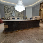 Oval White Marble TV Stand with Cream Diamond-Stitched Leather Trim and Dark Glossy Panels